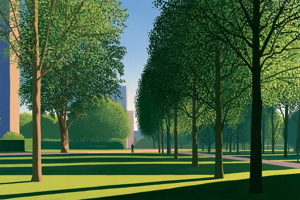 A tree-lined promenade through a city park